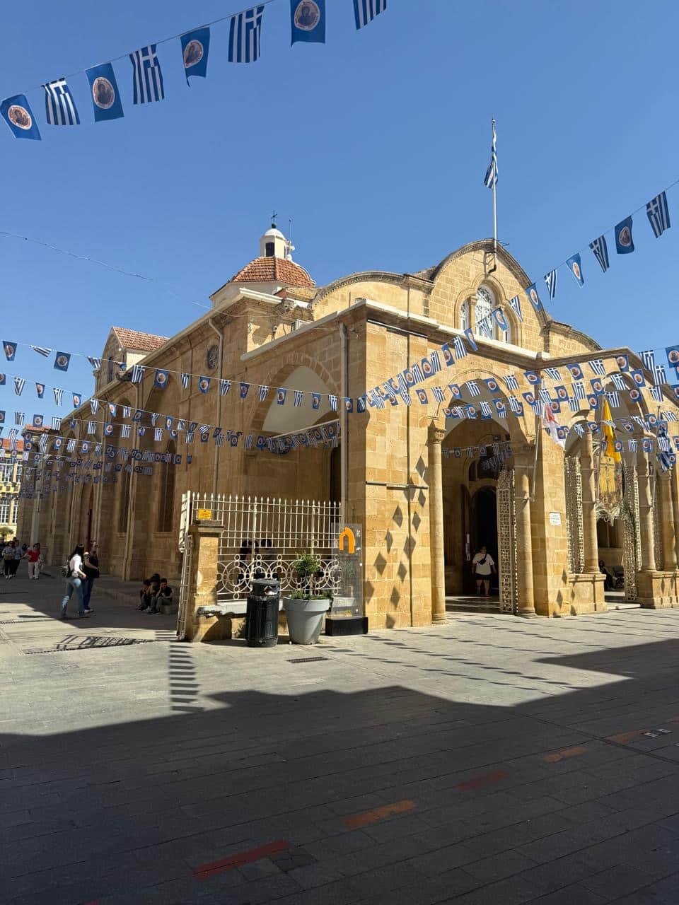 Faneromeni Church in Nicosia old town with Greek flags